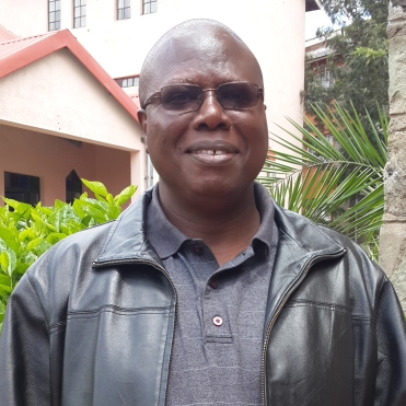 Alex Wamakobe (Vicar's Warden)